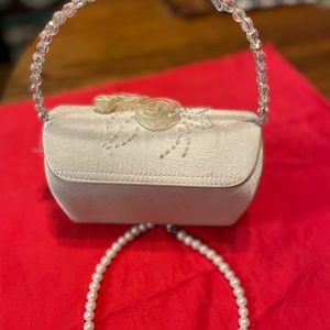 Adorable set of girls dressy handbag and faux pearls.
